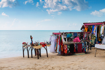 Booth on the beach with clothes - obrazy, fototapety, plakaty