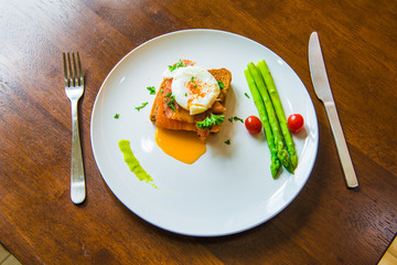 Sandwich with poached egg, parma ham and Salmon