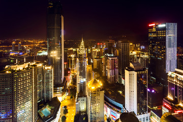 Obraz premium High angle view of illuminated skyline and modern buildings