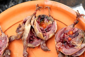 Boiled quail for cooking at the market.