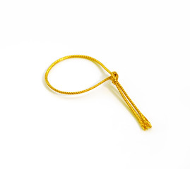 Golden rope over white background