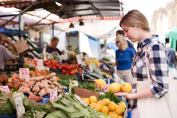 young woman at the market shopping