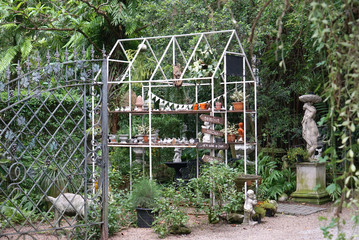 House shape metal truss structure in the English garden