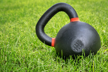 Fototapeta na wymiar heavy competition kettlebell in backyard