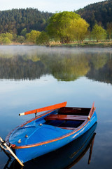 Obraz premium Landscape by the river with boat