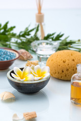 Spa concept with Floating Flowers, Sponge, essential oil