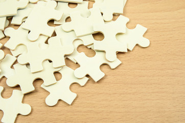 jigsaw puzzle pieces on wood background