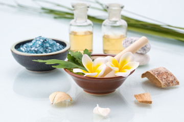 Spa concept with Mortar and Pestle, Flowers, leaf, essential oil