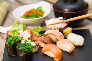 Clamping sushi with chopsticks