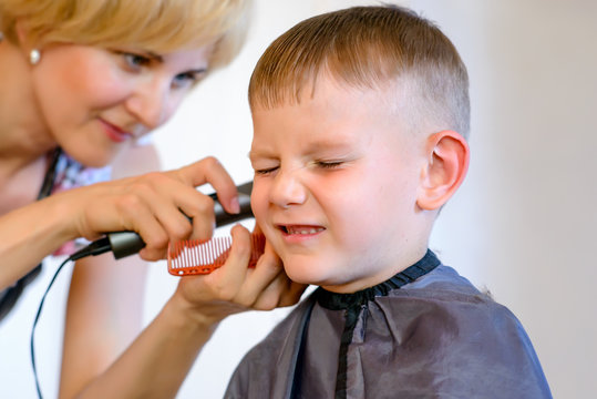 Little Boy Unimpressed With His Haircut