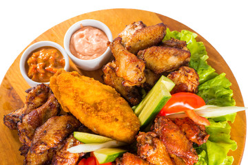 Fried chicken wings with vegetables
