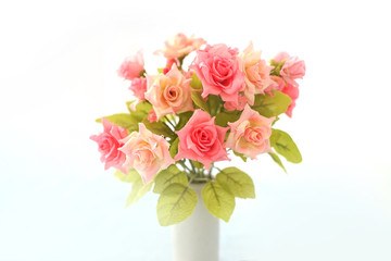 artificial pink roses bouquet in ceramic vase