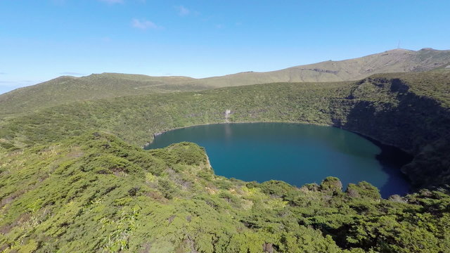 Aerial video footage of the calderira negra,Flores island on the volcano in azores, Fayal, Portugal 