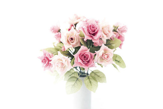 artificial pink roses bouquet in ceramic vase, high key style