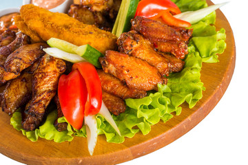 Fried chicken wings with vegetables
