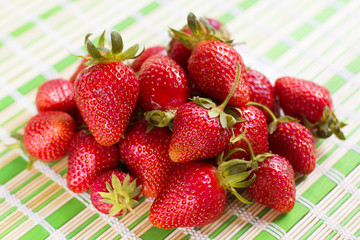 Fresh juicy strawberries lying on the table.