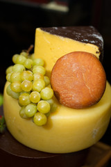 Still life picture with cheese and grape