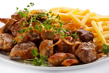 Kebab, chips and vegetables 