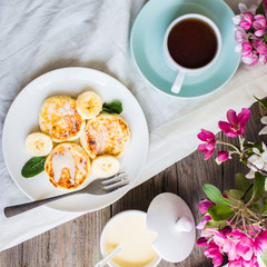 Homemade cottage cheese pancakes  with banana, condensed milk,br