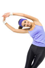 smiling woman, in violet sportswear, doing stretching exercise o