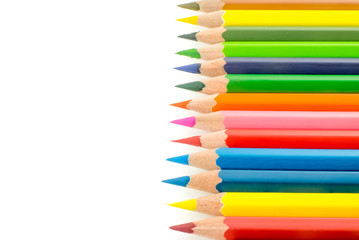 Colored pencils on white background
