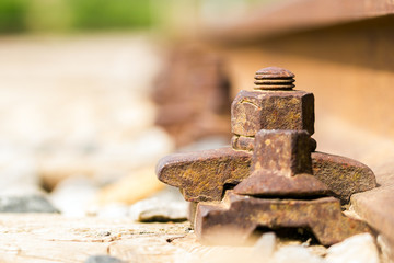 Rusty rail fastening system, low point of view. Italy