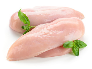 Raw chicken fillets with basil isolated on white