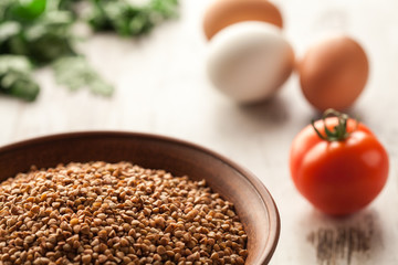 Ceramic bowl with buckwheat.