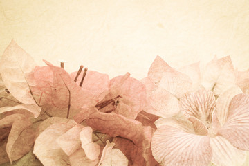 Fototapeta na wymiar Sweet flowers on mulberry paper texture 