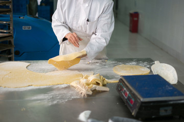 Pastry Chef Tossing Fresh Pie Crusts