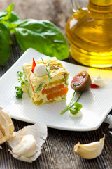 Vegetables pie with fresh herbs on the plate