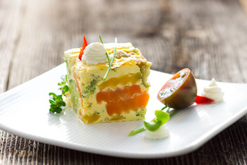 Vegetables pie with fresh herbs on the plate