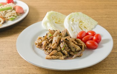 Spicy Grilled Pork Salad on A White Dish