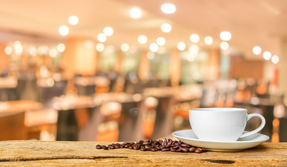 Coffee shop blur background with bokeh image .