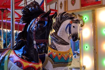 Fototapeta na wymiar Brightly Painted Horses on an Antique Carousel.