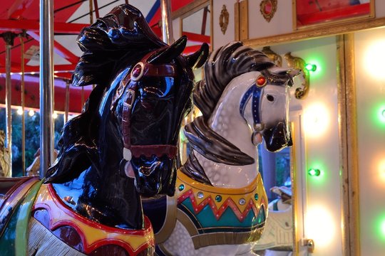 Brightly Painted Horses on an Antique Carousel.