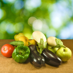  various vegetables on the table on green background closeup