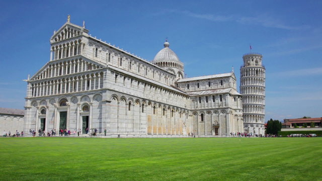 Tourists on Square of Miracles visiting Leaning Tower in Pisa, Italy