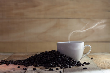 cup of black coffee and beans