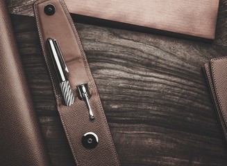 Luxurious rollerball pen on a wooden background