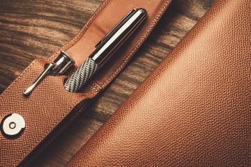 Luxurious rollerball pen on a wooden background