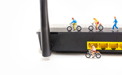 image of mini figure dolls riding bike and running on wifi route