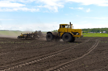 Tractor plowing a field
