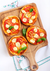Tomato and mozzarella mini pizzas