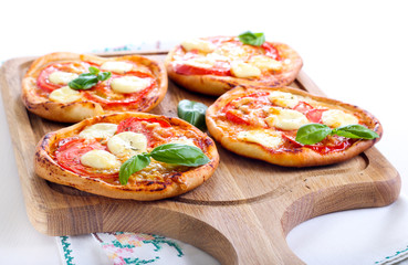 Tomato and mozzarella mini pizzas