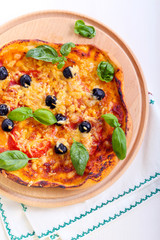 Tomato, basil and olive mini pizza