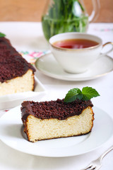 Fototapeta na wymiar Cheesecake with chocolate topping