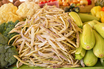 Green beans and various vegetable on market/Fresh vegetables arranged on farmers market