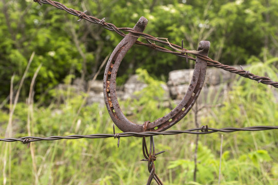 horseshoe used as a fence tightener for barbed wire, Kansas