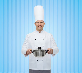 happy male chef cook holding pot